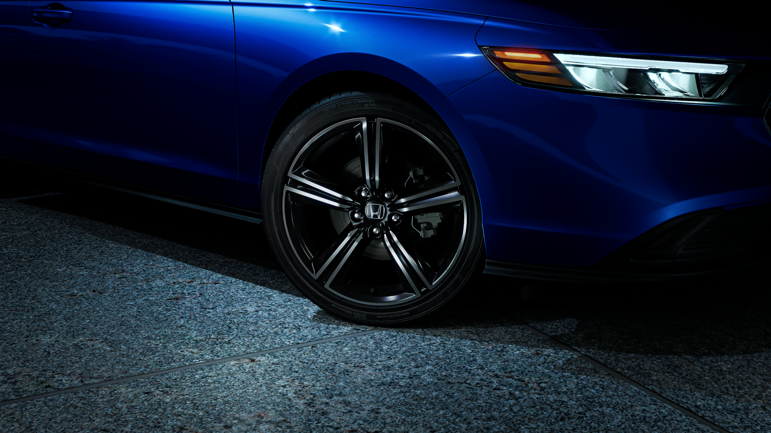 Side exterior of a blue Honda