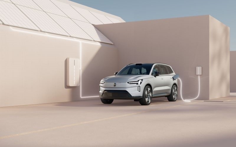 Volvo EX90 Electric Vehicle charging on charger port connected to building