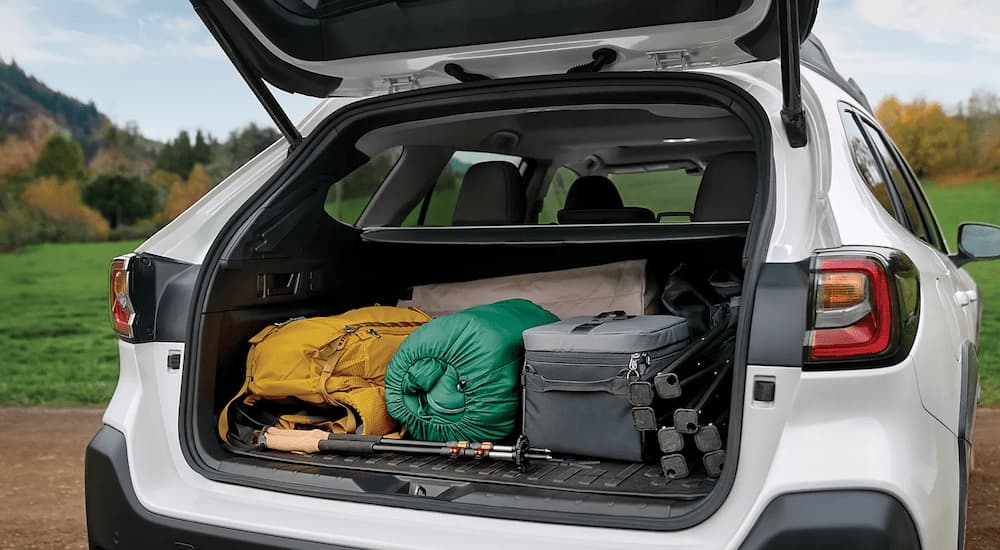 Cargo and hiking gear in the back of a white 2025 Subaru Outback