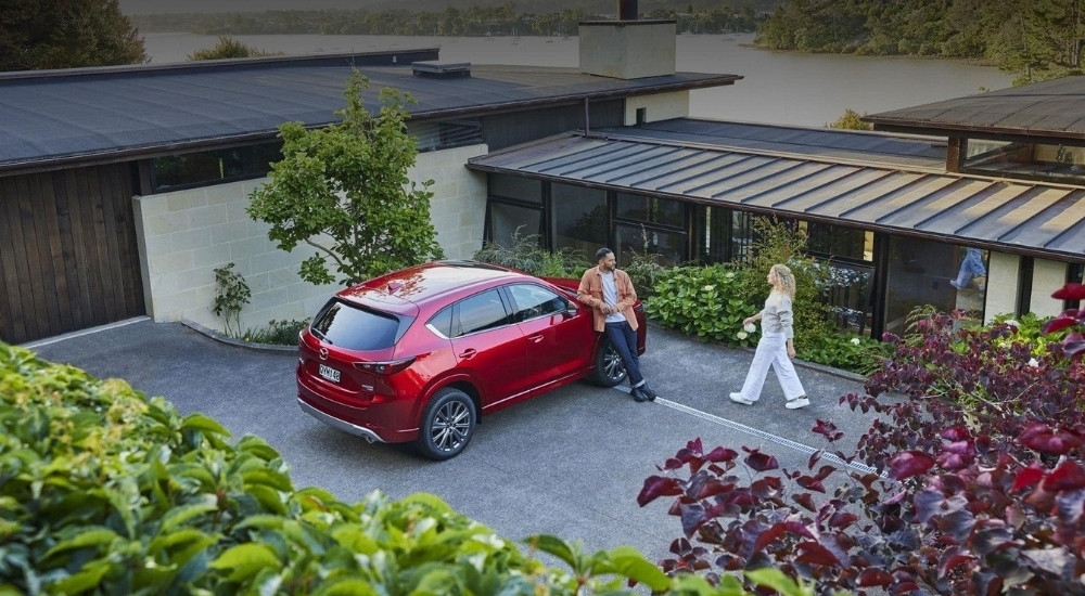 Red 2025 Mazda CX-5 parked on a driveway
