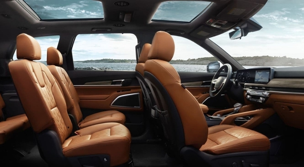 Side view of the brown leather seats inside of a 2025 Kia Telluride.