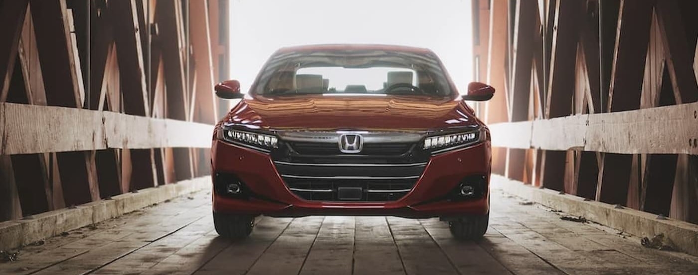 A red 2022 Honda Accord parked on a bridge.