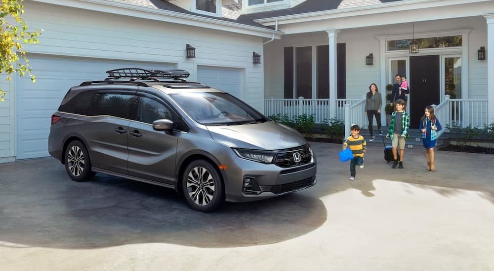 Grey 2026 Honda Odyssey parked in a driveway