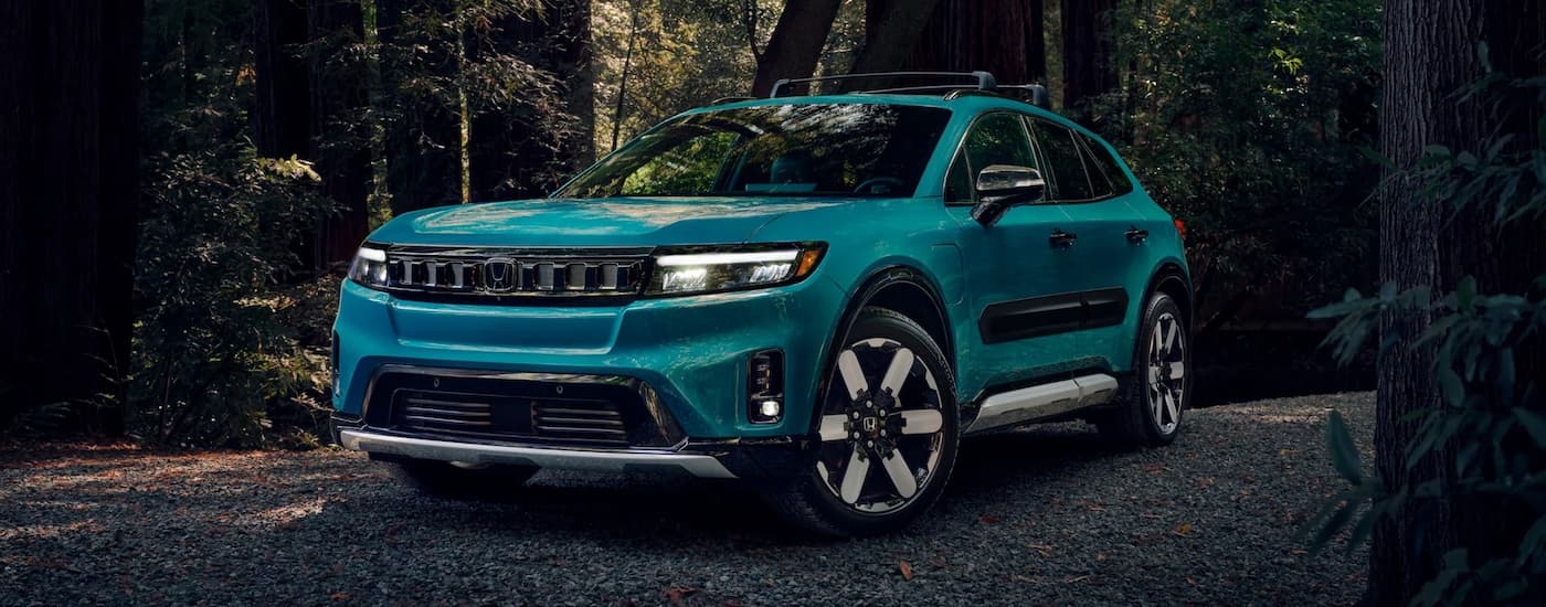 A blue 2025 Honda Prologue parked off-road