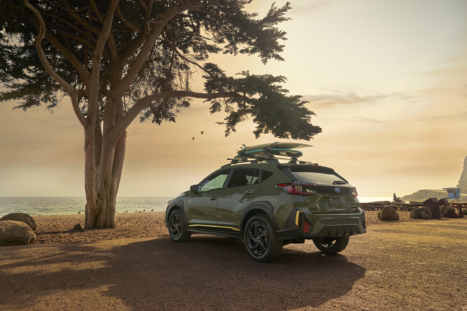 Crosstrek with mountains in the distance near Riverton