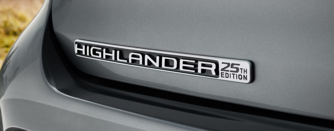 Trunk badge on a grey 2025 Toyota Highlander Hybrid Limited 25th Edition