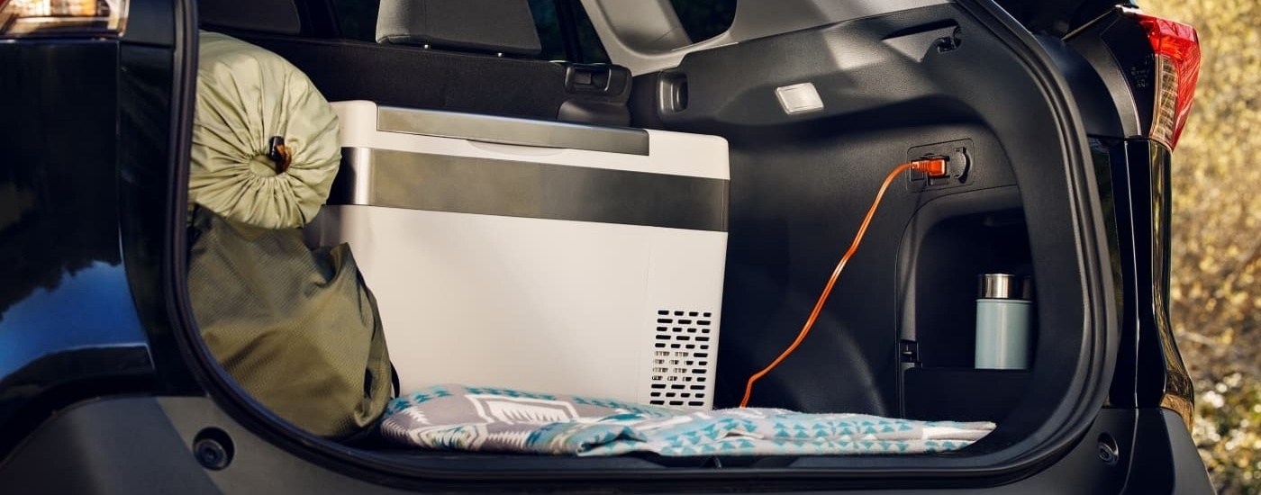 Cooler in the trunk of a black 2024 Toyota RAV4