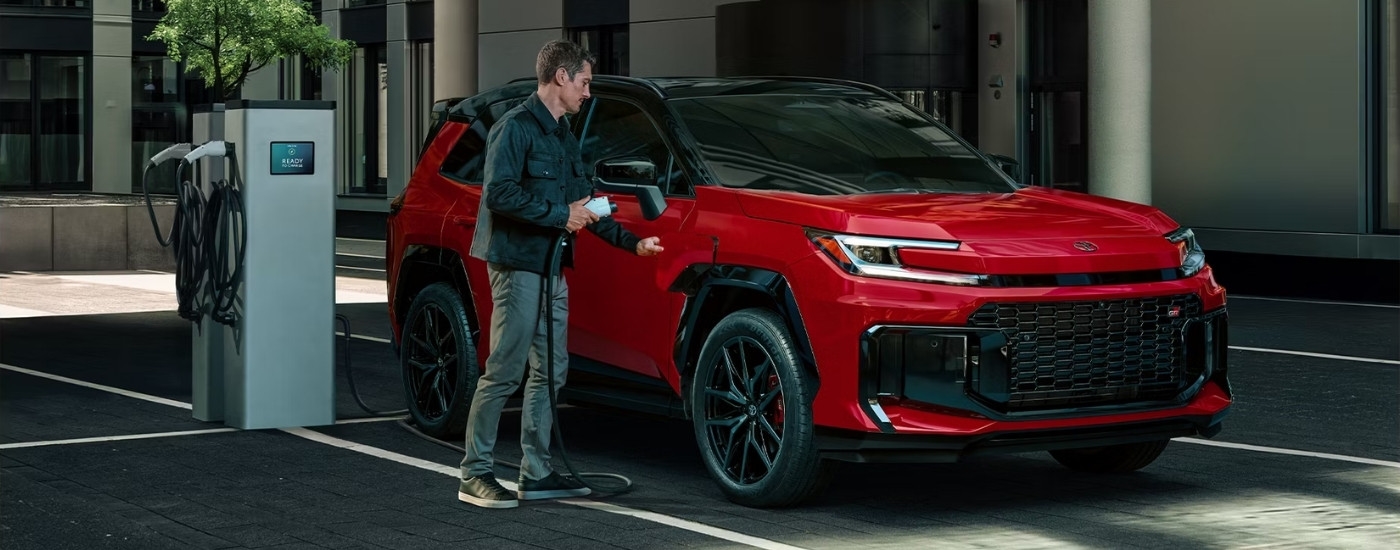 Red 2025 Toyota RAV4 for sale near The Bronx charging
