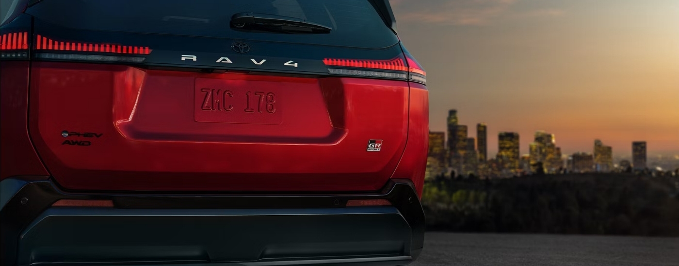 Rear of a red 2026 Toyota RAV4 Hybrid for sale near The Bronx