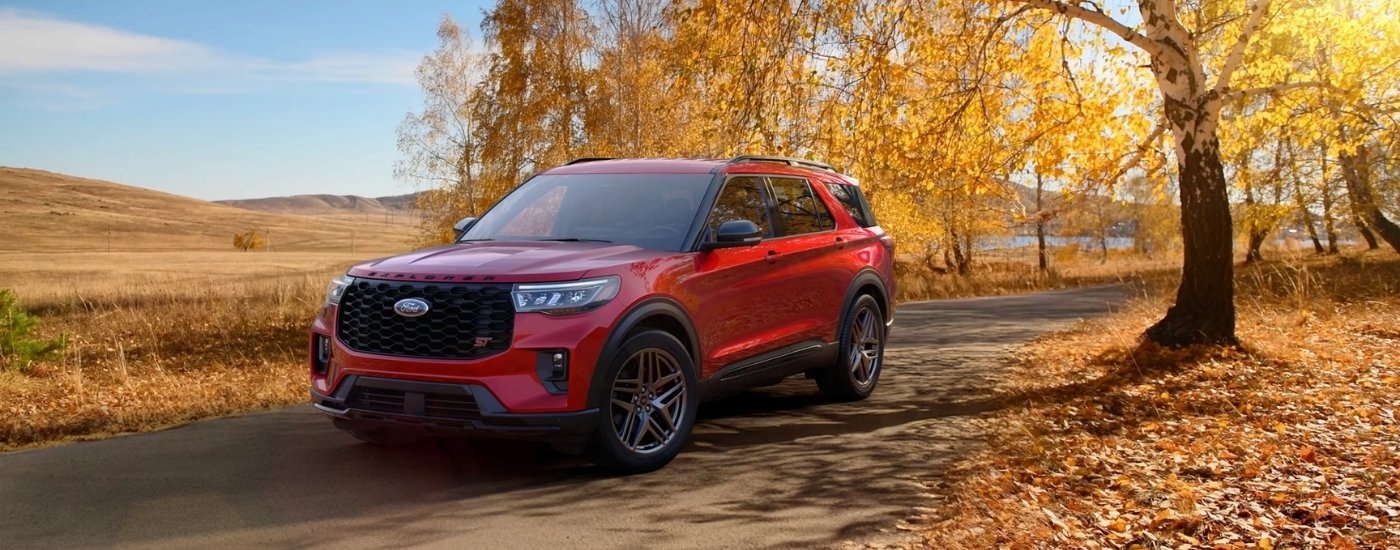 Red 2026 Ford Explorer ST parked on a trail
