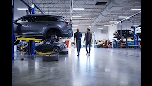 Mazda Service Technician walking in the service center at #1 Cochran Mazda North Hills near Gibsonia, PA