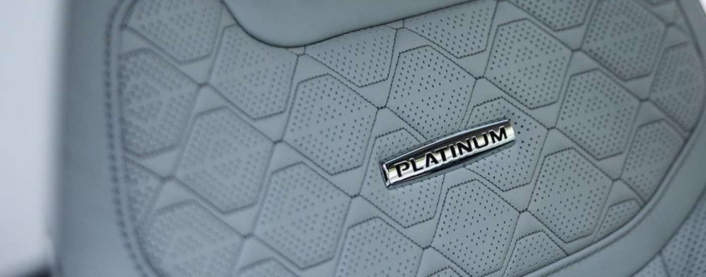 Badge on the grey seat in a 2025 Ford Explorer Platinum