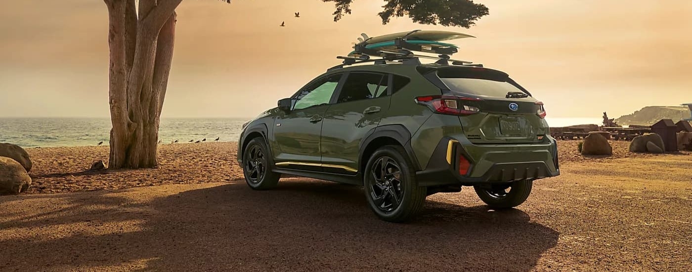 A green 2026 Subaru Crosstrek parked near water.