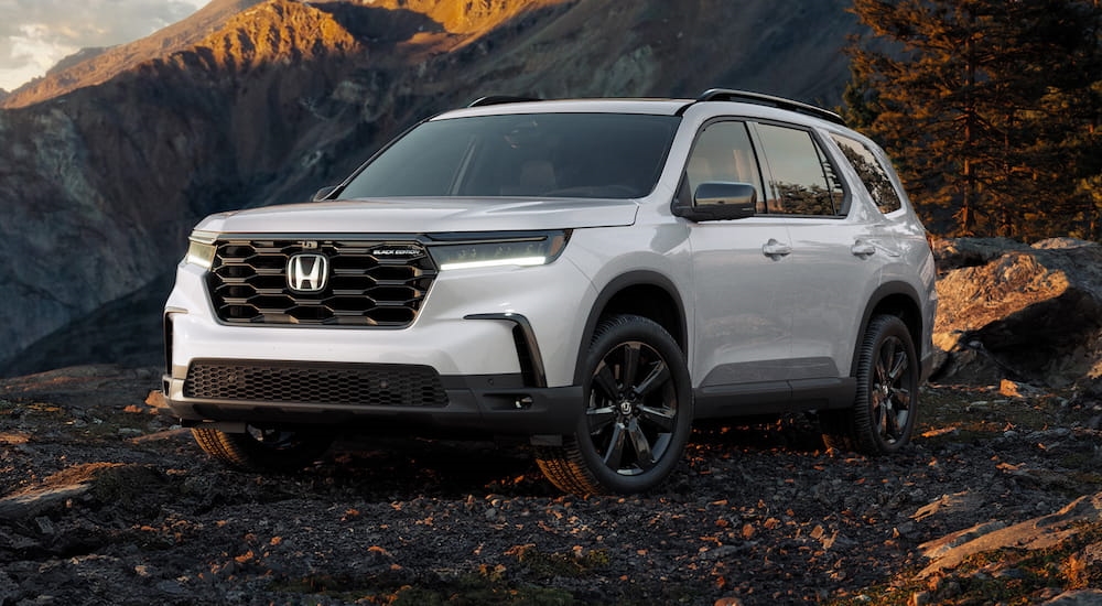 White 2025 Honda Pilot Black Edition for sale near Mill Creek parked off-road.