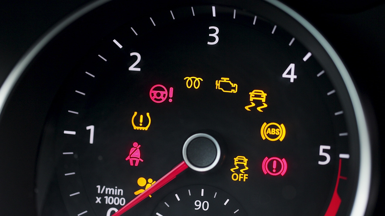 A lit-up dashboard indicating Subaru check engine light service