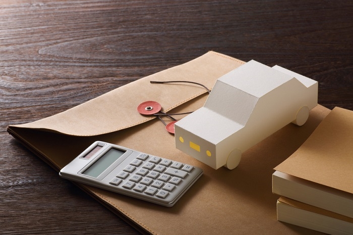 Subaru financing materials with toy car