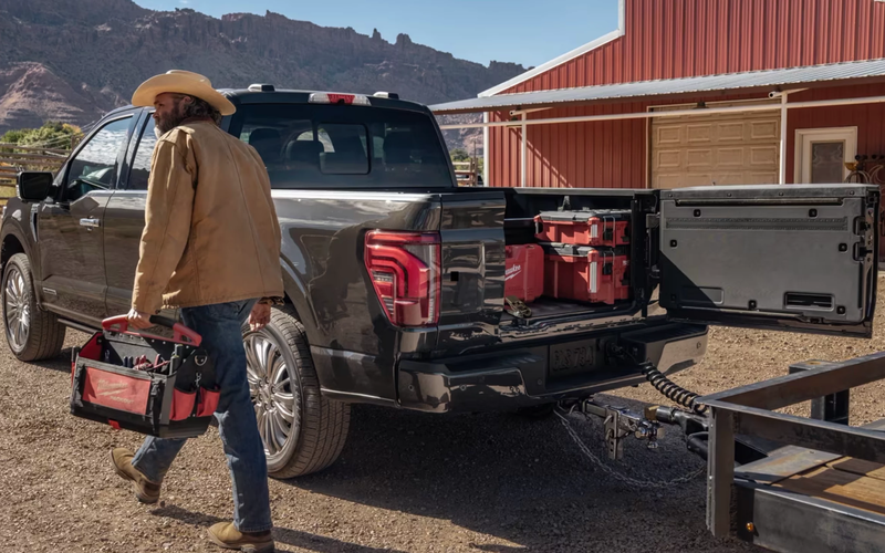 Ford Truck on a Texas Rd with man in cowboy hat.
