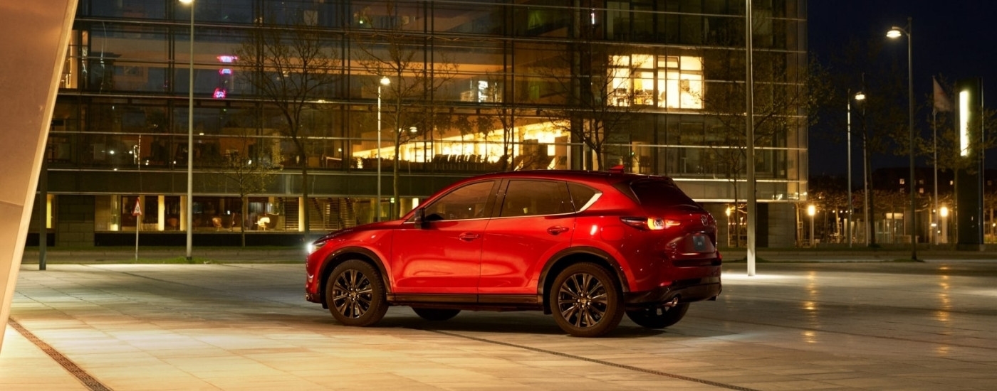 A red 2025 Mazda CX5 from the side.