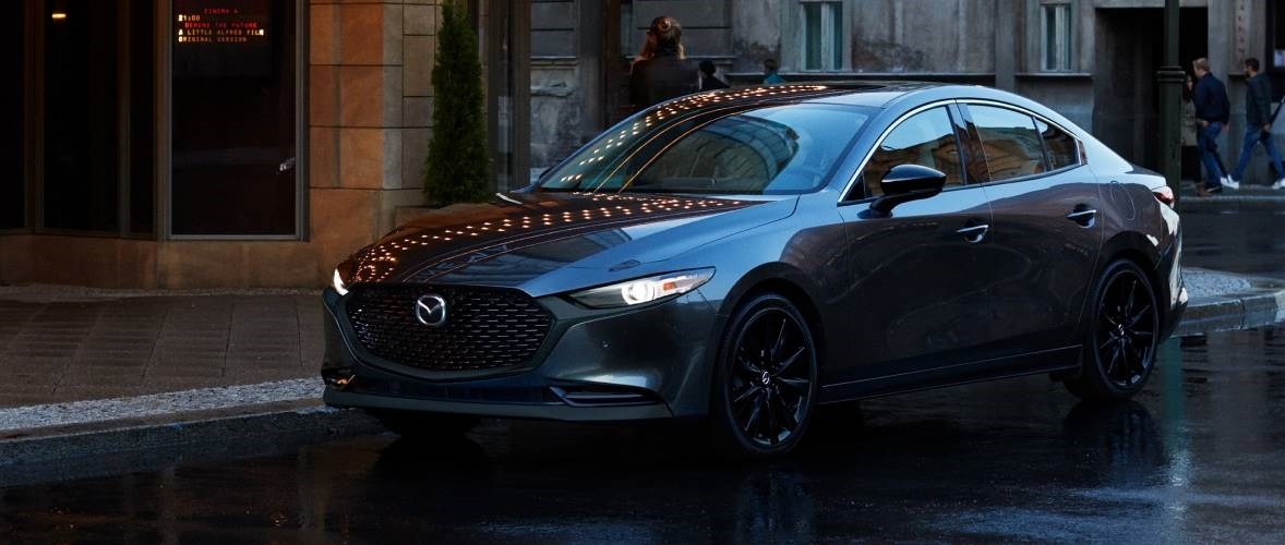 A grey 2025 Mazda3 Sedan from the front after leaving a Mazda dealer near Coral Gables.