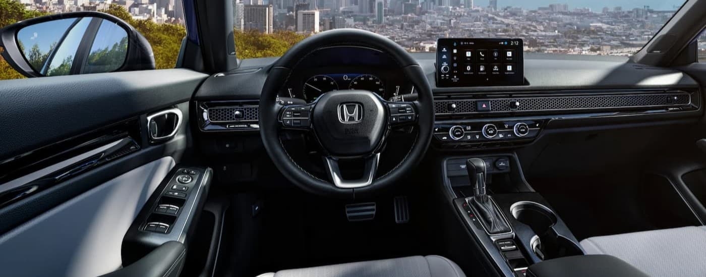 The black interior and dash in a 2025 Honda Civic.