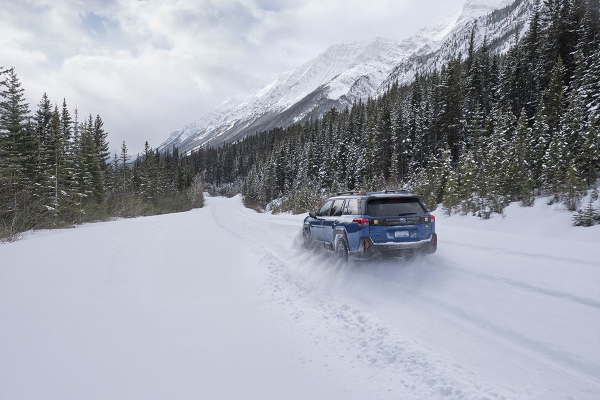 Subaru driving through snow