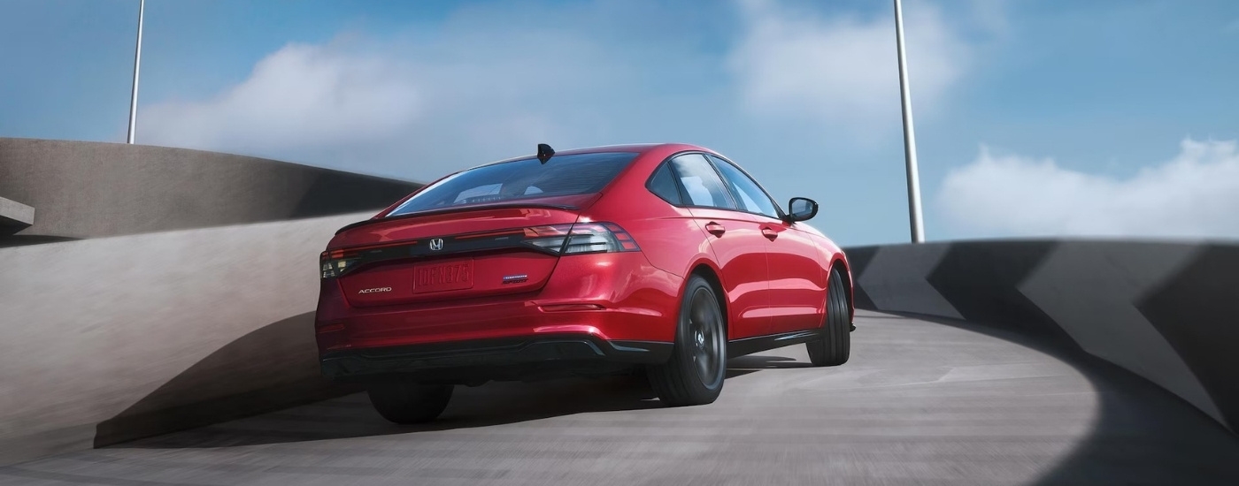 A red 2025 Honda Accord from the rear at an angle.