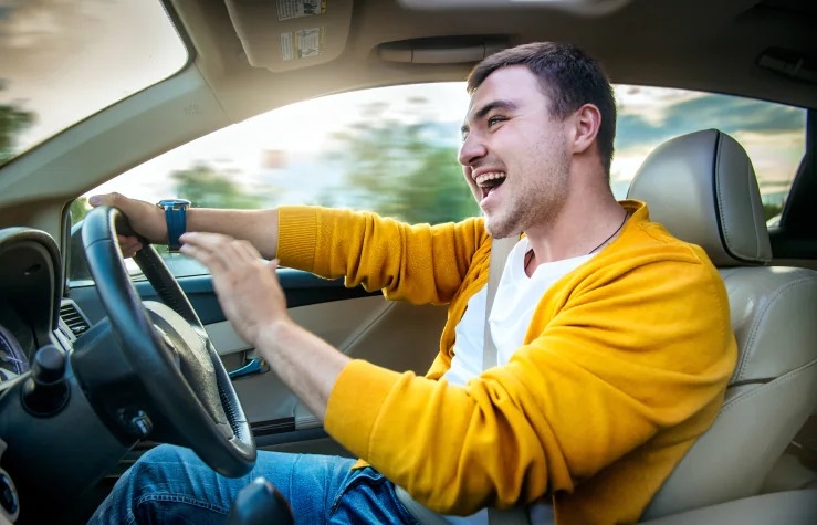 Happy driver in first car