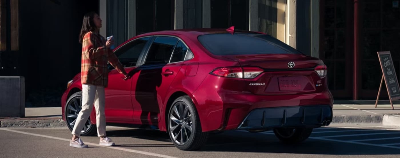 A red 2026 Toyota Corolla parked on a parking spot.