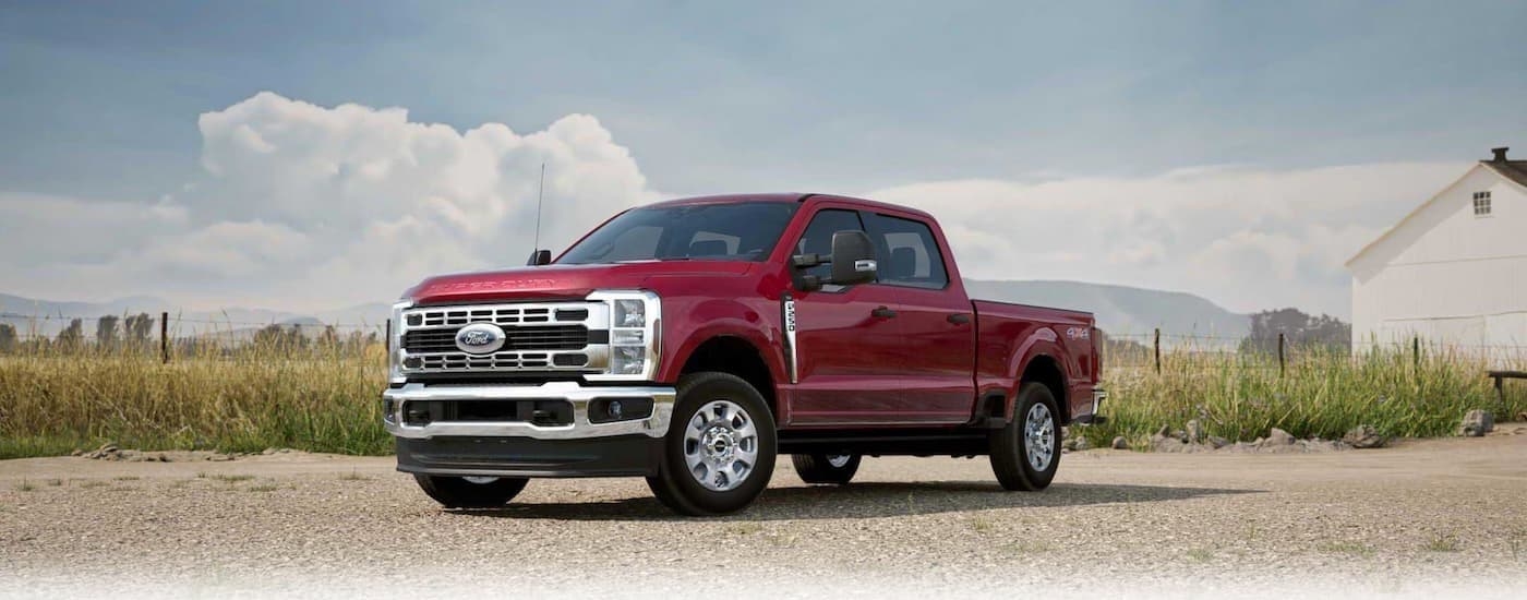 a red 2026 Ford F-250 parked off-road.