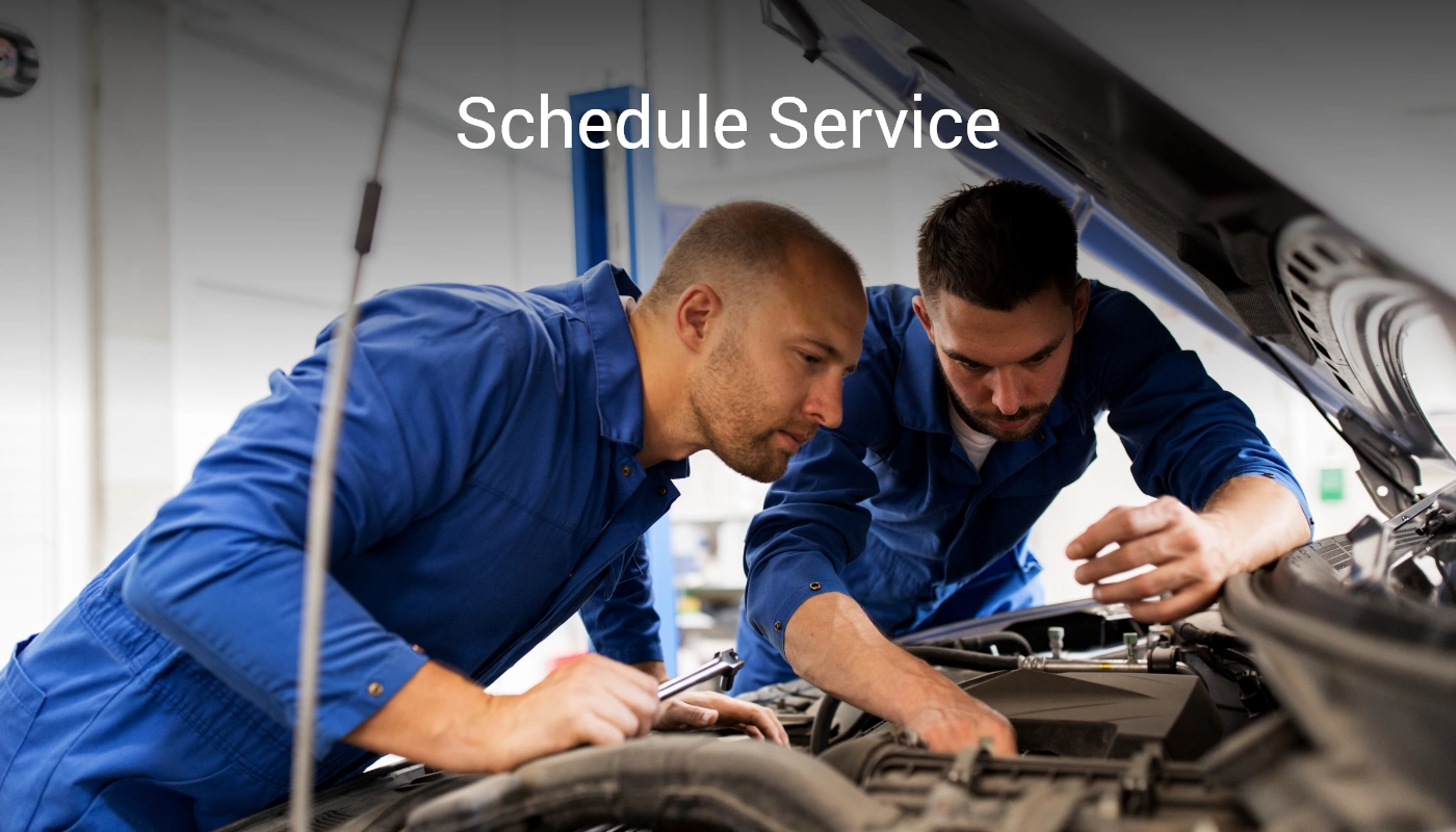 Mechanic working on car engine