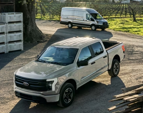 Ford F-150 & Transit Van commercial vehicles parked in a driveway