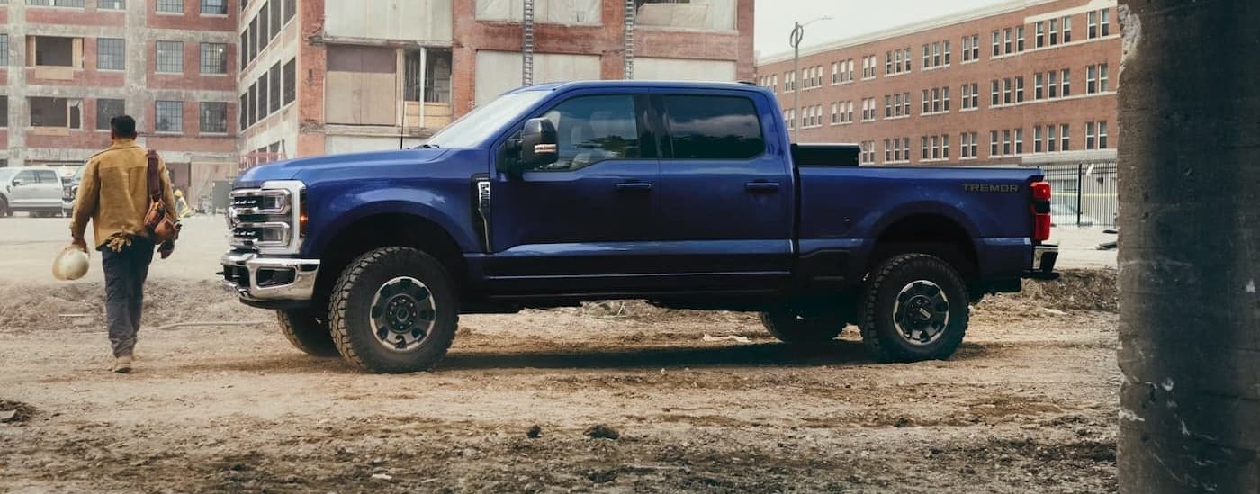 A blue 2026 Ford F-250 parked on a construction site.