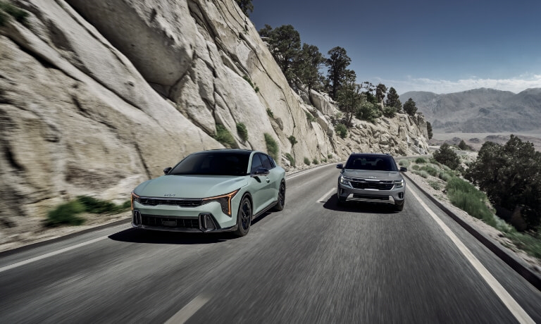 2025 Kia K4 Exterior Two Driving In Mountains