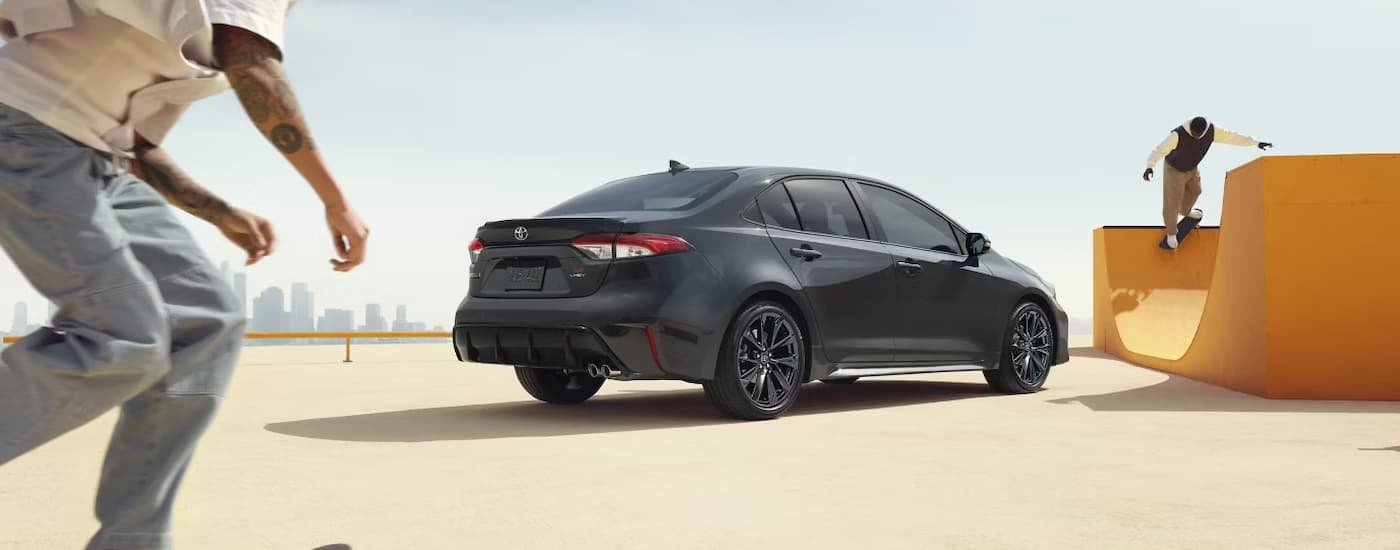 Side view of a grey 2026 Toyota Corolla at a skate park