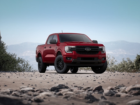 red 2026 Ford Ranger pickup truck parked on the side of the road