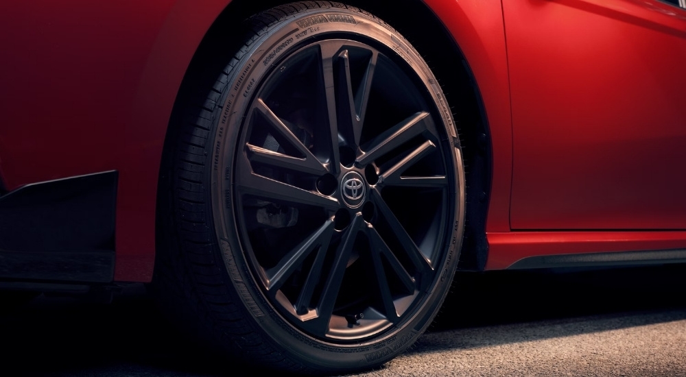 Black wheel on a red 2026 Toyota Camry Nightshade