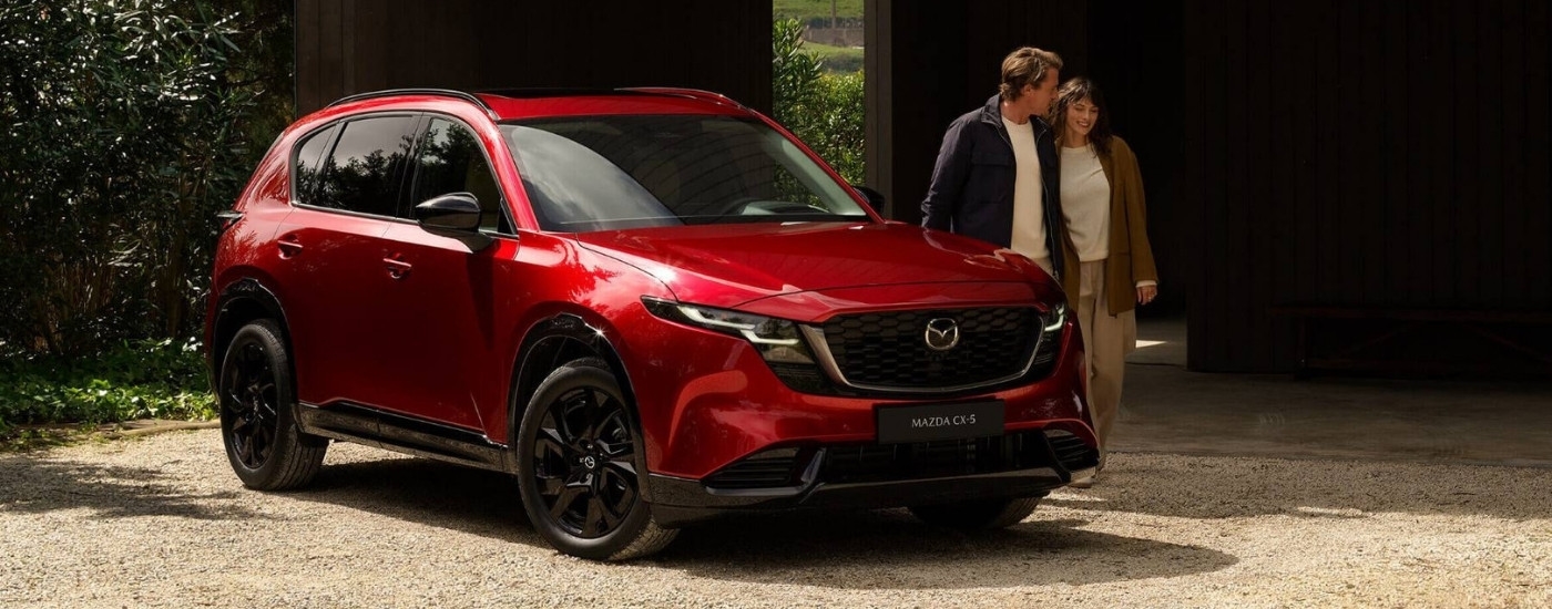 Red 2026 Mazda CX-5 for sale near North Miami parked near a couple
