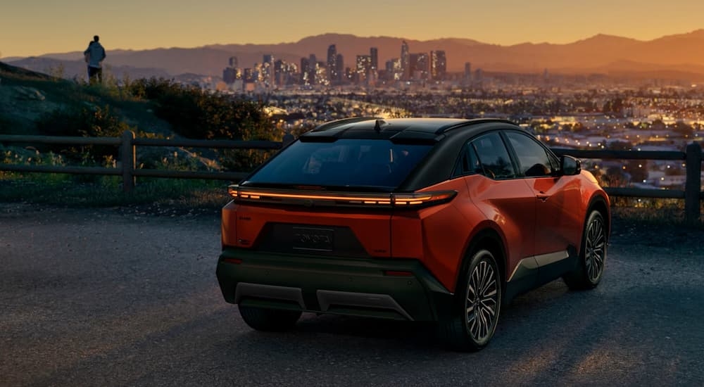 Rear of a 2026 Toyota CH-R parked overlooking a city