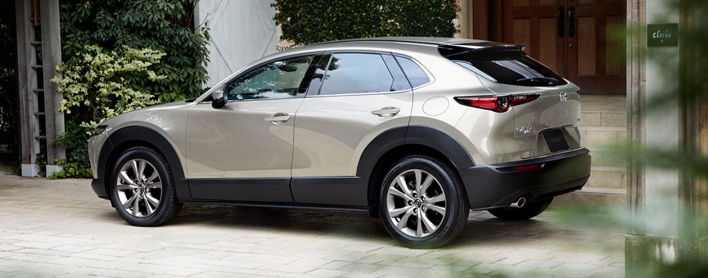 Tan 2025 Mazda CX-30 parked on a driveway