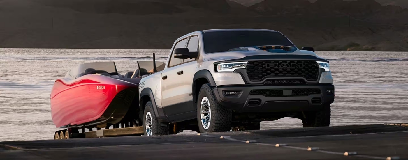 A silver 2025 Ram 1500 from the front at an angle.