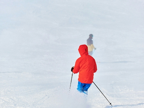 person skiing down a slope in Bountiful, UT