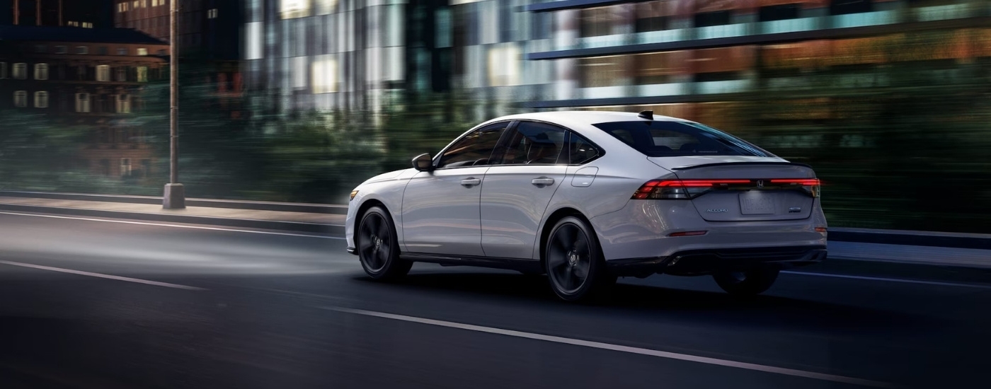 A white 2025 Honda Accord from the rear at an angle.