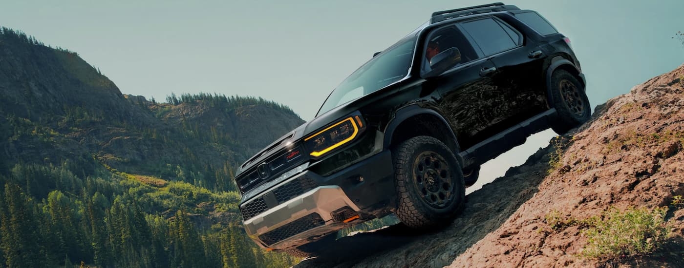 A black 2026 Honda Passport TrailSport Elite off-roading for sale