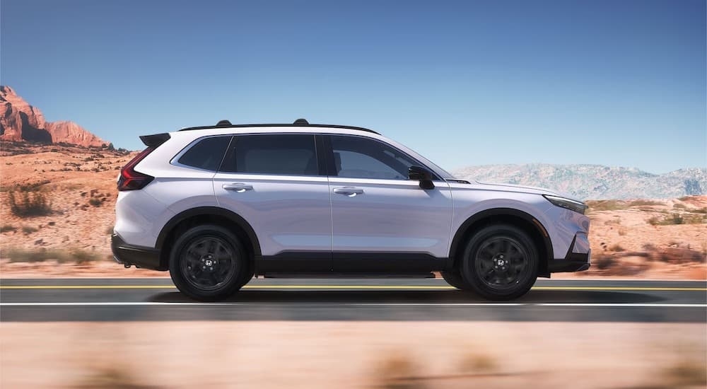 A white 2025 Honda CR-V from the side.