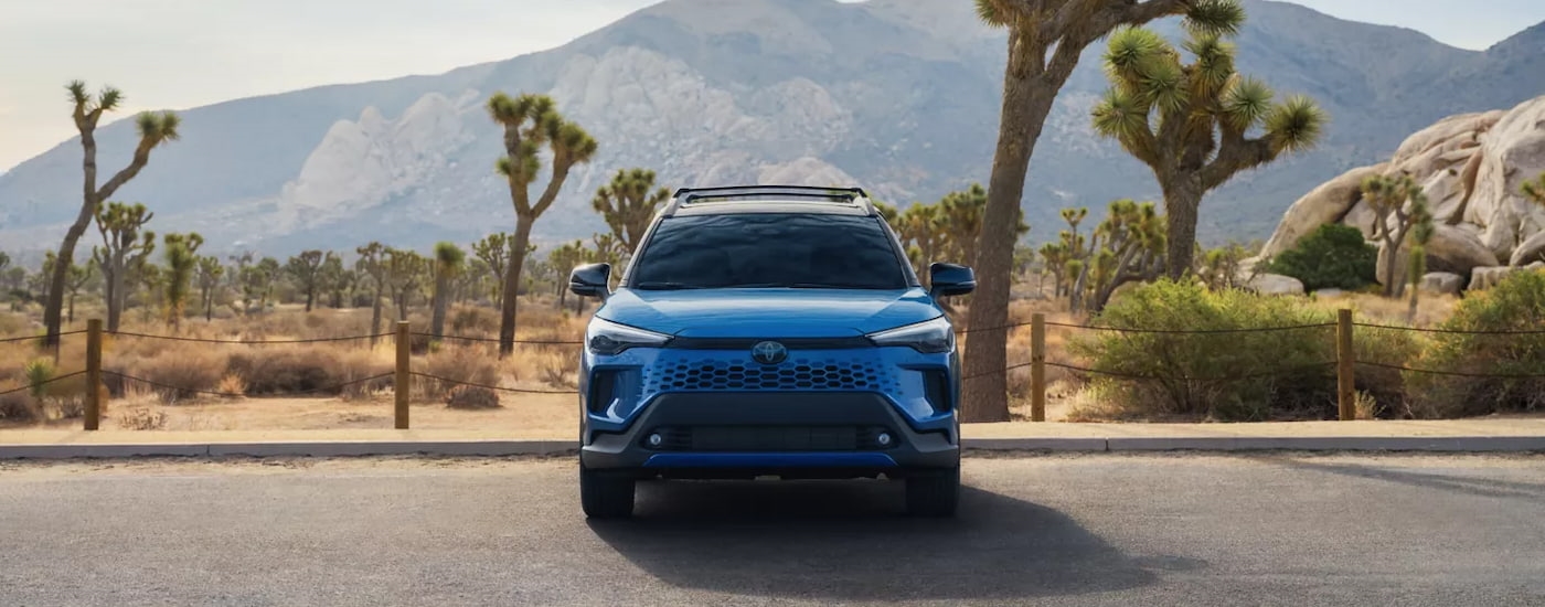 Blue 2025 Toyota Corolla Cross for sale near White Plains parked on pavement.