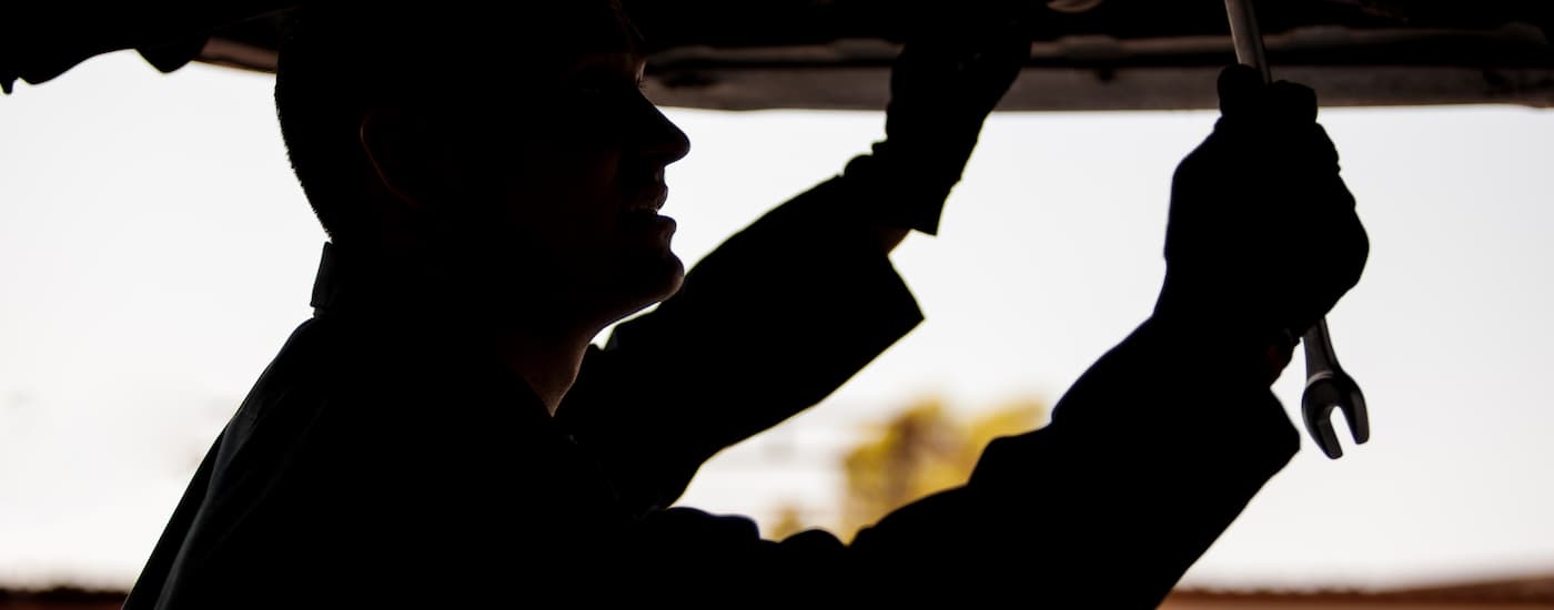 Mechanic working underneath a vehicle