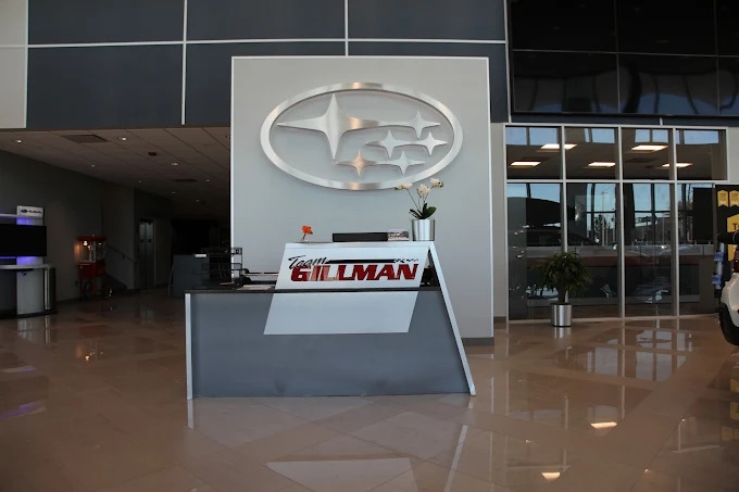 Happy Team Gillman Subaru North Happy female customer after buying new Subaru SUV 