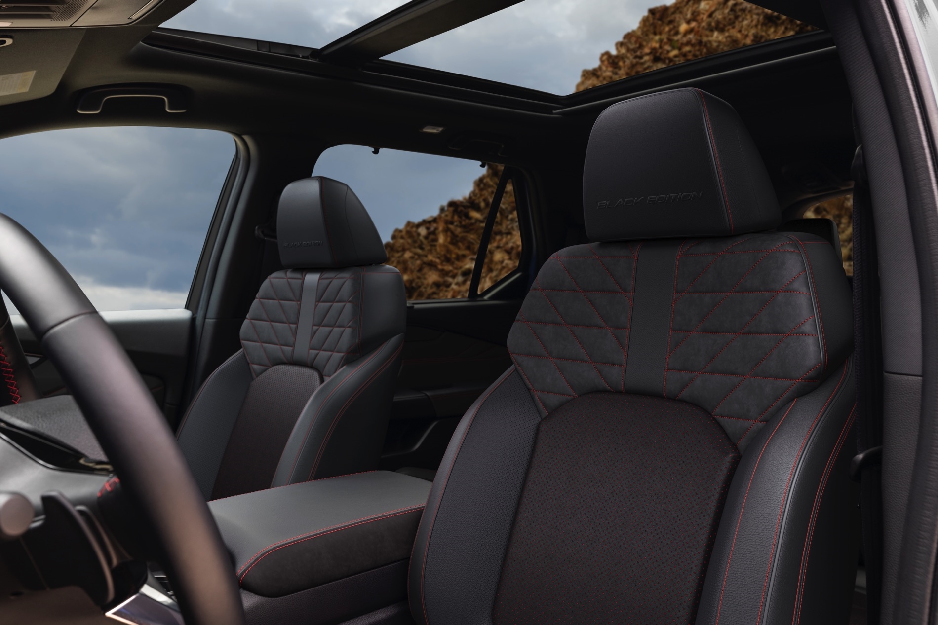 2026 Honda Pilot interior view of the front seats in a dark material