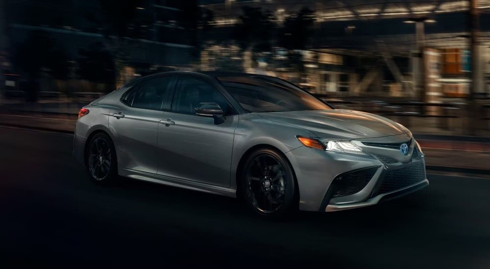 Grey 2026 Toyota Camry for sale near Franklin driving down a road.