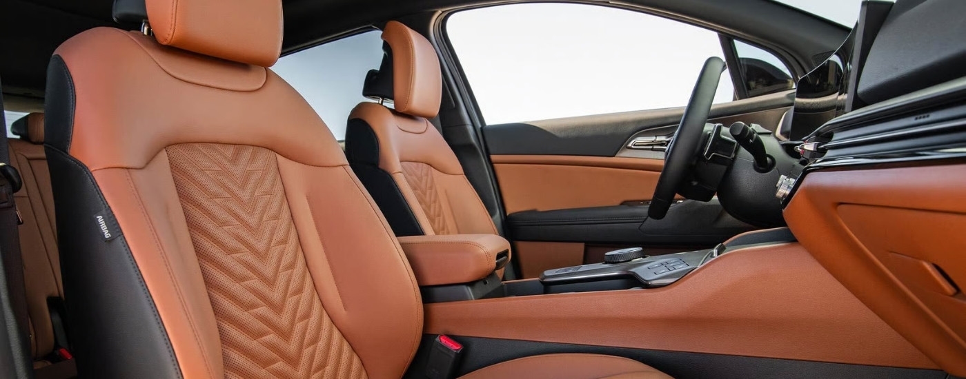 The orange interior of a 2026 Kia Sportage.